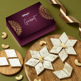 Gourmet cookies on a wooden board with a Gifteet box and cashews on a green background